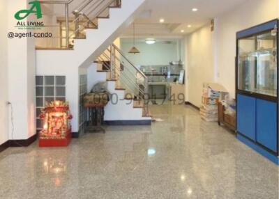 Spacious lobby area with marble flooring and staircase