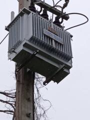 Outdoor electrical transformer on a utility pole