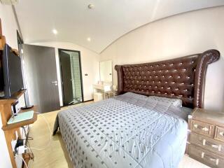 Spacious bedroom with large bed and modern amenities