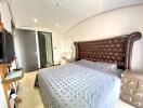 Spacious bedroom with large bed and modern amenities