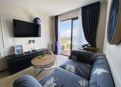 Cozy living room with modern furniture and balcony access