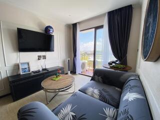 Cozy living room with modern furniture and balcony access