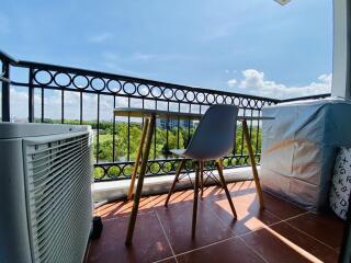 Spacious balcony with scenic view and modern chair