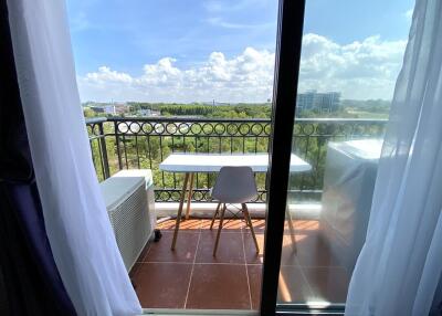 Spacious balcony with a view and outdoor seating area