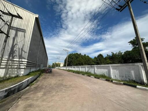 Paved outdoor area with buildings and sky