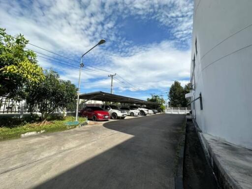 Outdoor parking area next to a residential building