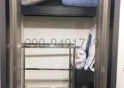 Empty closet with shelves and hanging space in a property