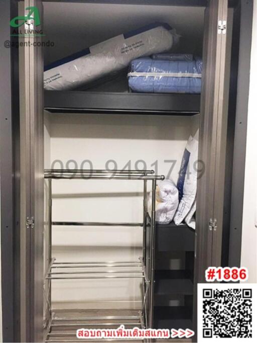 Empty closet with shelves and hanging space in a property