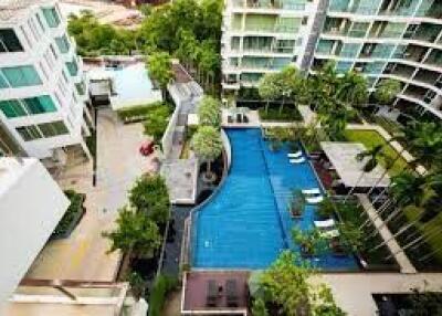 Aerial view of a residential complex with swimming pool and garden