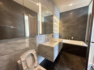 Modern bathroom with marble finish and elegant fixtures