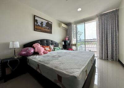 Spacious bedroom with natural light and modern decor