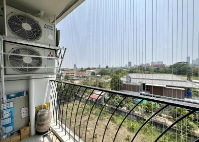 City view from the balcony with air conditioning units