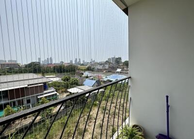 Spacious balcony with city view and safety railing