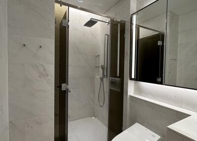 Modern bathroom with marble finish and glass shower