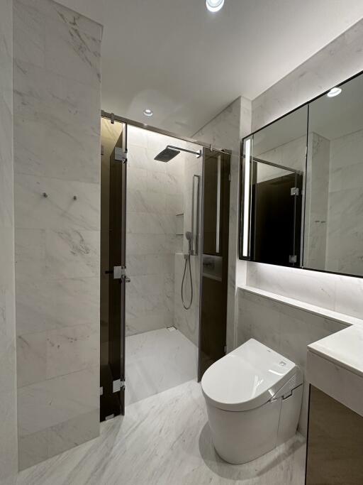 Modern bathroom with marble finish and glass shower