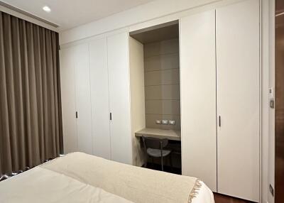 Modern bedroom with large wardrobe and study nook