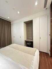 Modern bedroom with large wardrobe and study nook