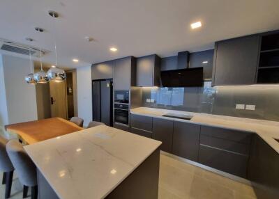 Modern kitchen with integrated appliances and center island