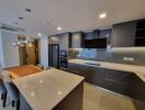 Modern kitchen with integrated appliances and center island