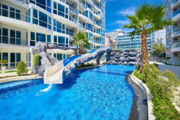 Luxurious apartment complex with a swimming pool and water slide
