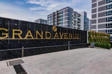 Front entrance of Grand Avenue residential building with sign