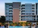 Modern residential building with pool at dusk