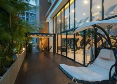 Cozy balcony with modern furniture and ambient lighting