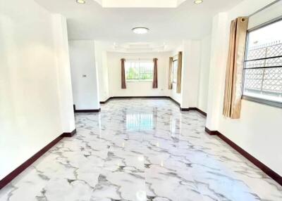 Bright and spacious corridor with marble flooring in a modern home