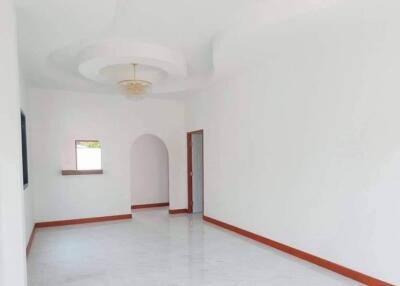 Spacious and Bright Empty Room with White Walls and Marble Flooring