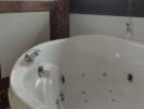 Spacious bathroom with large jacuzzi tub and elegant tile work