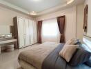 Cozy bedroom with large window and elegant decor