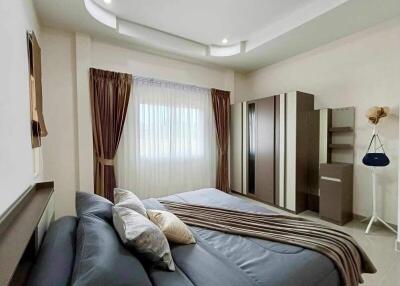 Modern bedroom with natural lighting and elegant decor