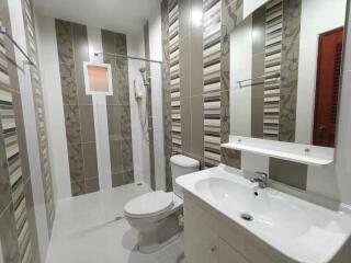 Modern bathroom with shower and neutral color scheme