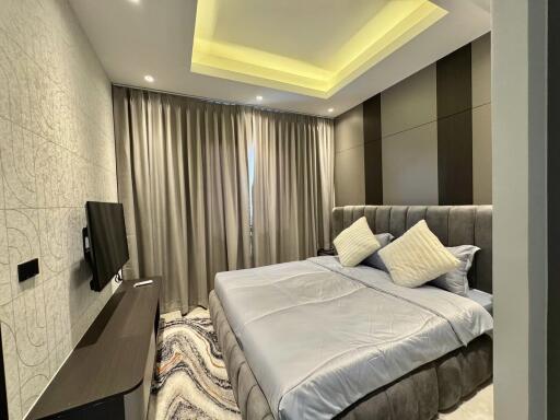 Modern bedroom with elegant design and ambient lighting