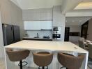 Modern kitchen with white cabinetry and central island