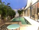 Modern home outdoor area with swimming pool and seating