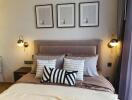 Cozy bedroom with a large bed, framed wall art, and stylish lighting fixtures