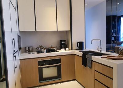 Modern kitchen with stainless steel appliances and wooden cabinetry