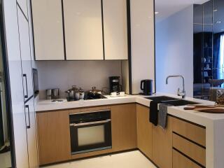 Modern kitchen with stainless steel appliances and wooden cabinetry