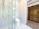 Modern bathroom with walk-in shower and gold fixtures