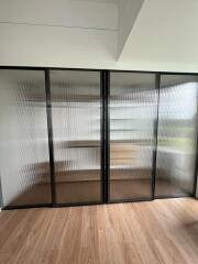 Modern room with large fluted glass wardrobe
