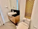 Modern bathroom with golden mosaic tiles