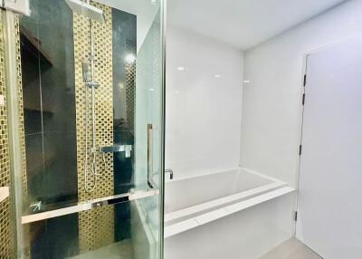 Modern bathroom with glass shower and bathtub