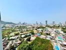 Panoramic city view from high-rise apartment balcony