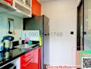 Modern kitchen with stainless steel appliances and red cabinets