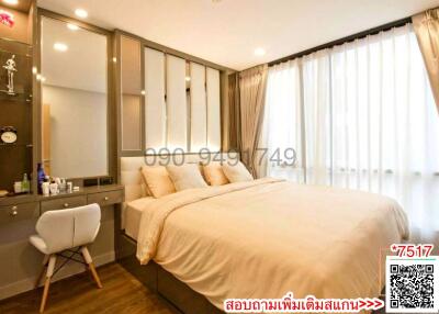 Modern bedroom interior with a large bed, ample lighting, and a sleek design