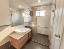 Spacious modern bathroom with walk-in shower and large vanity