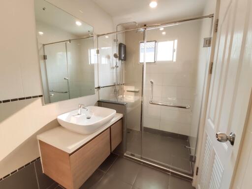 Spacious modern bathroom with walk-in shower and large vanity