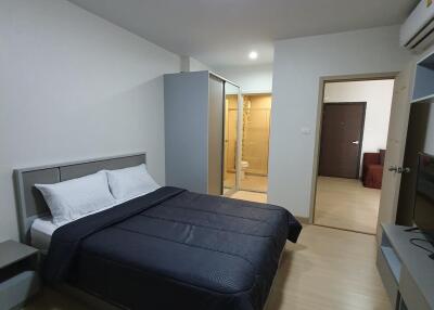 Cozy bedroom with en-suite bathroom and wooden flooring