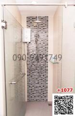 Modern bathroom with walk-in shower and mosaic tile wall